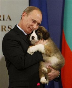 Russia's Prime Minister Putin hugs a Bulgarian shepherd dog after receiving it as a present from Bulgaria's Prime Minister Borisov, in Sofia